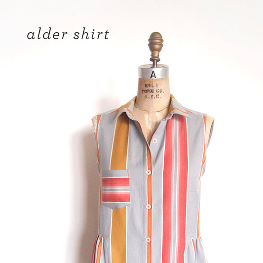 Alder Shirtdress refashioned as sleeveless shirt in gray, coral, and mustard vertical stripes on dress form