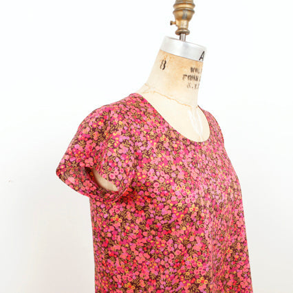 Scout Woven Tee in pink and red floral Liberty print with scoop neck and cap sleeves on dress form