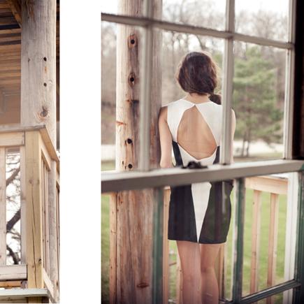 Person wearing sleeveless black and white color-block tank dress with open back, standing by window with wooden frame