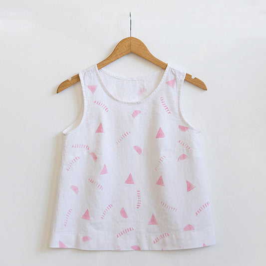 Willow Tank in white linen with hand potato-printed pink triangles and dashes, hanging on a wooden hanger