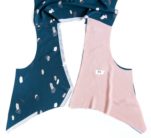 Felix Dress neckband pieces in teal abstract print and pink lining with interfacing, laid flat showing assembly