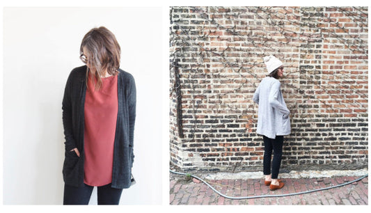 Driftless Cardigan: charcoal over a rose top with black pants, and light gray with off-white knit hat against a brick wall