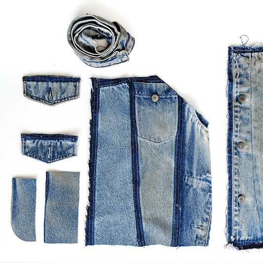 Moss Skirt pattern pieces laid flat including waistband, pockets, front and back panels cut from repurposed denim
