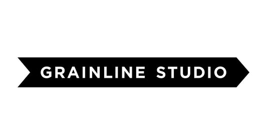 Grainline Studio black banner logo with white text