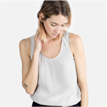 RTW inspiration for Willow Tank: white sleeveless scoop neck tank with relaxed fit, worn with black pants