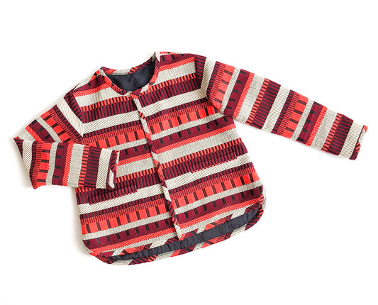 Tamarack Jacket in red and cream striped jacquard with button front and long sleeves, displayed flat on white background