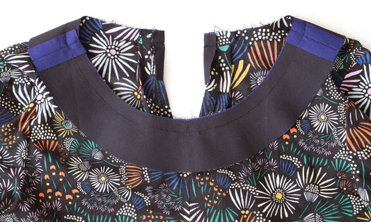 Hadley Top jewel neckline facing sewn in place on colorful floral print, seam allowances visible at shoulders