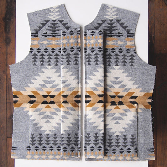 Cascade Duffle Coat front panels in Pendleton wool gray and gold geometric print, laid flat showing mirrored construction