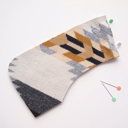 Cascade Duffle Coat undercollar in cream, tan, and charcoal Pendleton wool geometric print, pinned on white background