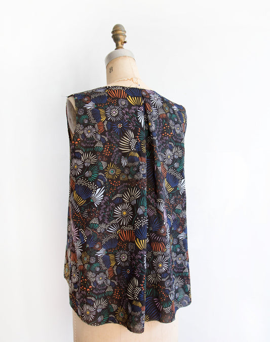 Hadley Top in navy floral print with yellow, orange, white, and teal flowers, back view with center pleat on dress form