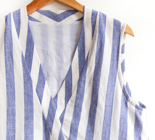 Felix Dress in blue and white striped linen-rayon, crossover V-neckline, showing bias facing applied to sleeveless armhole