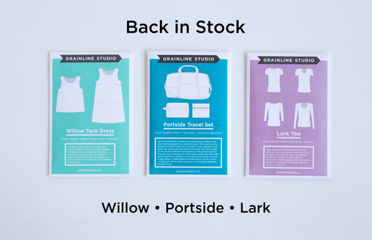 Three Grainline Studio pattern envelopes back in stock: Willow Tank Dress, Portside Travel Set, and Lark Tee