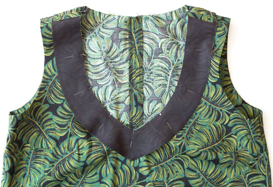 Hadley Top V-neckline facing interfaced and pinned in place on charcoal and green leaf-print fabric