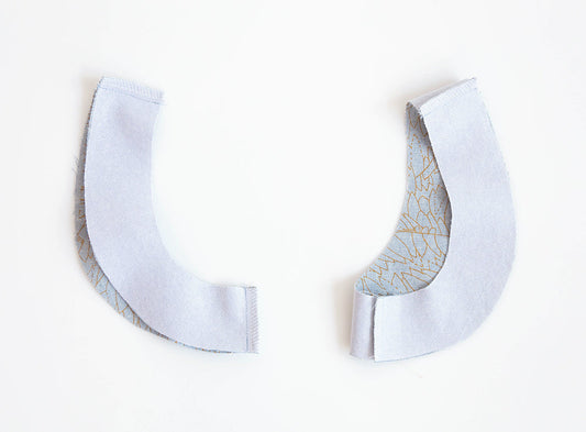 Farrow Dress armhole facings: light blue line print right side and white interfaced wrong side, seam allowances trimmed