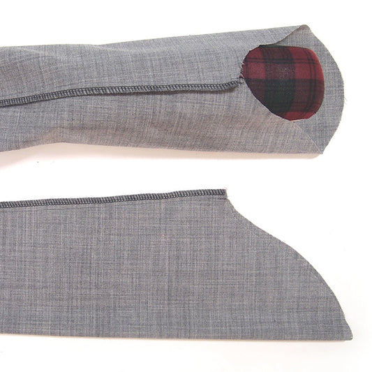 Morris Blazer sleeve on sleeve roll showing sleeve cap ease and serged seam, with flat sleeve piece below for comparison