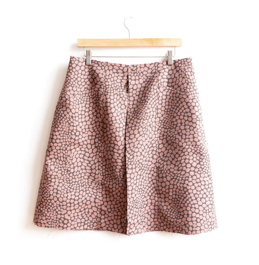 Reed Sew-Along: Center Front, Back and Side Seams, showing dusty pink abstract dot skirt with raw edges on wooden hanger