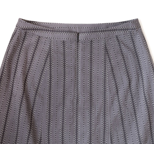 Reed Skirt close-up showing finished waistband and invisible zipper in gray embroidered stripe fabric