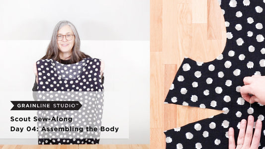 YouTube thumbnail for Scout Sew-Along Day 04: Assembling the Body, woman holding tee, pinning dart on polka dot fabric