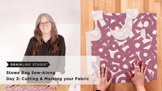 YouTube thumbnail for Stowe Bag Sew-Along Day 3: Cutting & Marking your Fabric, mauve print fabric pieces on wood surface