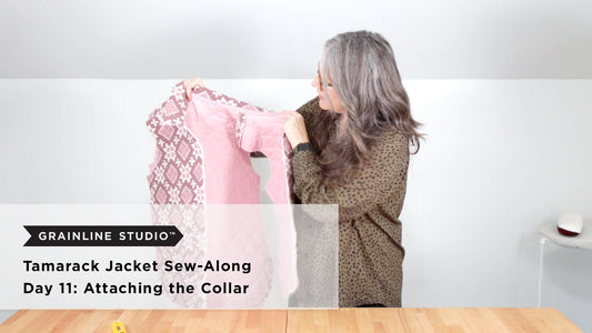 YouTube thumbnail for Tamarack Jacket Sew-Along Day 11: Attaching the Collar, woman holding up pink quilted jacket