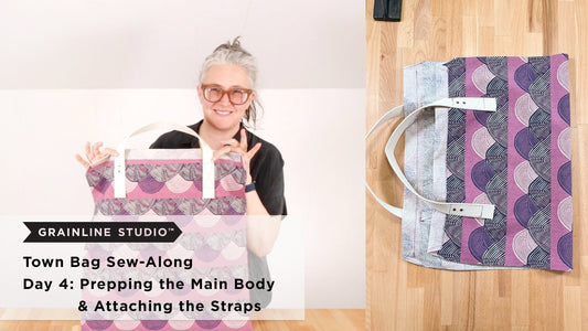 Grainline Studio Town Bag Sew-Along Day 4 thumbnail with purple wave print bag body and white handles shown held and flat