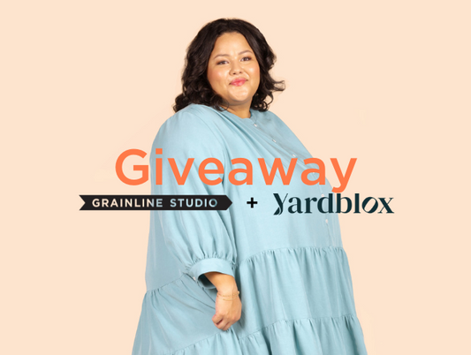 Grainline Studio and Yardblox giveaway graphic — model in light blue rayon linen blend Poppy Dress on peach background
