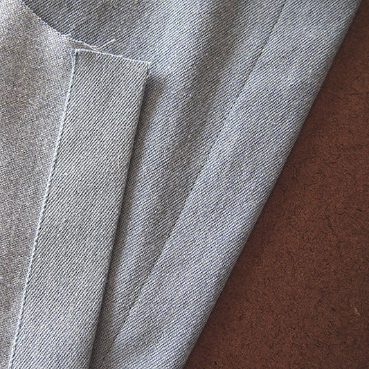 Alder Shirtdress light-wash denim button band shown from both right and wrong sides, with folded and topstitched edge finish