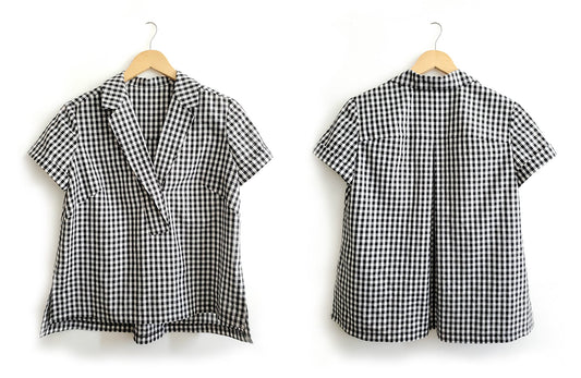 Front and back views of Augusta Shirt in black and white gingham with short sleeves and open collar, hung on wooden hangers