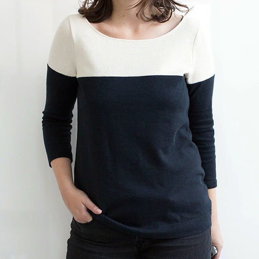 Lark Tee in cream and navy colorblock with three-quarter sleeves and boatneck, worn with dark jeans against a white wall