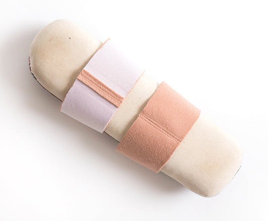 Sleeve roll with interfaced blush wool sleeve facings, right and wrong side visible, seam allowances pressed open