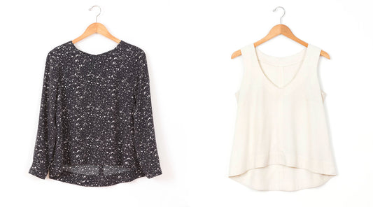 Hadley Top View A in black speckled long-sleeve and View B in cream sleeveless, both on wooden hangers