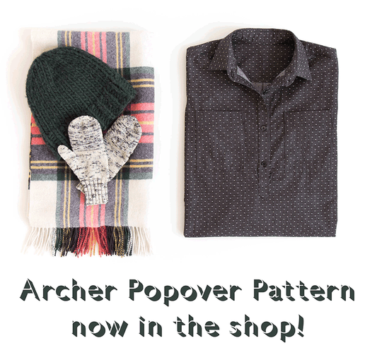 Archer Popover pattern announcement with folded charcoal dot shirt, plaid wool scarf, green knit beanie, and gray mittens