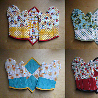 Four quilted oven mitt and potholder sets in floral and geometric prints in red, yellow, blue, and cream colorways