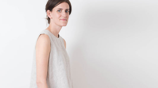 Hadley Top in natural linen, sleeveless swing silhouette, side view against white background