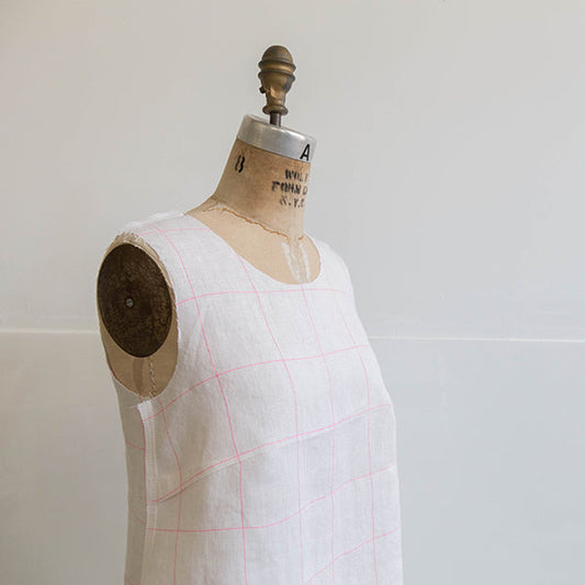 Willow Tank in white and neon pink windowpane linen on a vintage dress form, showing bodice construction and seam placement