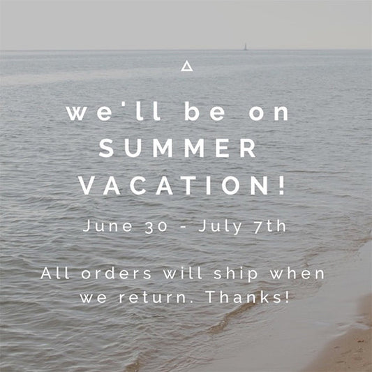 Grainline Studio summer vacation notice June 30-July 7th, orders ship on return, overlaid on calm ocean and beach scene