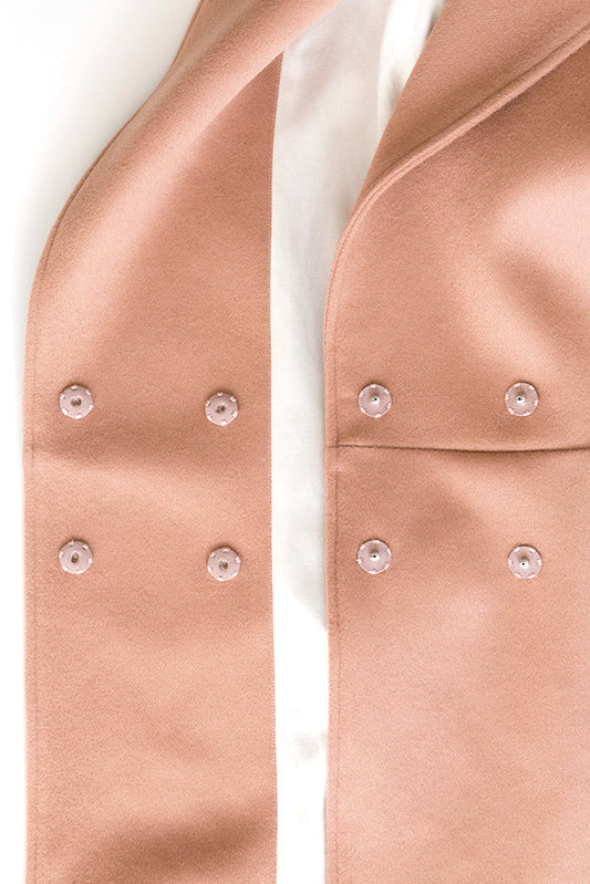 Yates Coat front closure detail: two fabric layers with snap fasteners, Kashi lining showing between