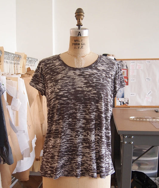Scout Tee in black and white burnout knit on a Wolf Form dress form, with pattern pieces visible in the background