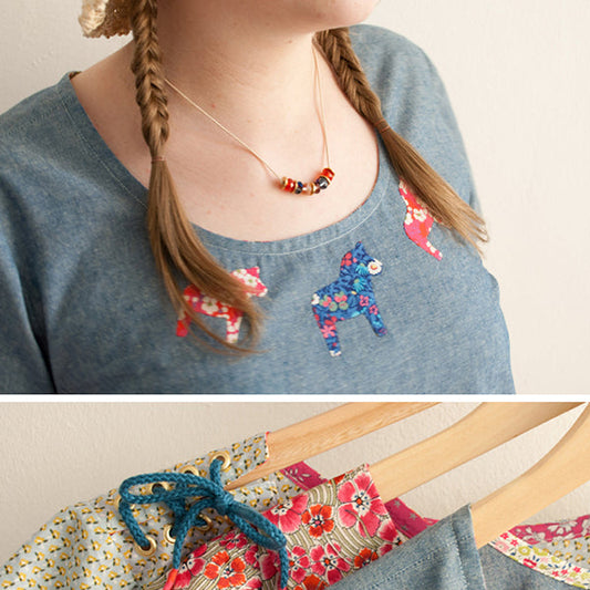 Scout Tee in blue chambray with floral dala horse appliqués and beaded necklace, with detail of coordinating Liberty fabrics