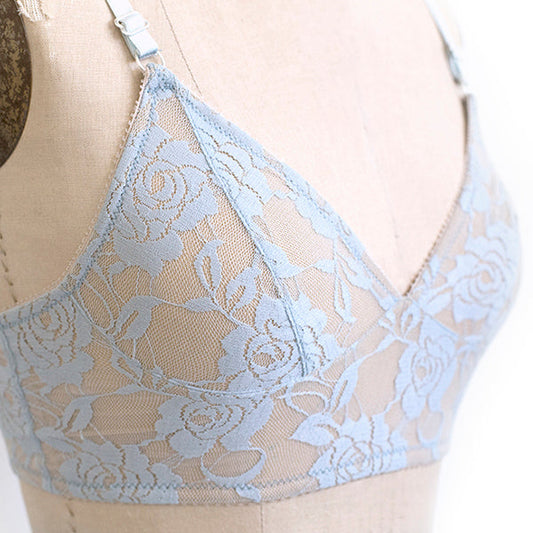 Light blue floral lace Watson Bra on dress form, showing lace overlay, fitted cup construction, and adjustable straps