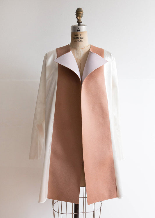 Yates Coat sew-along on dress form showing white Kashi lining attached to interfaced blush wool front facings