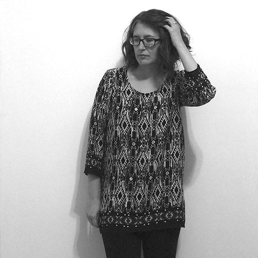 Black and white photo of a Scout Tee variation in geometric ikat print, lengthened to tunic length with three-quarter sleeves