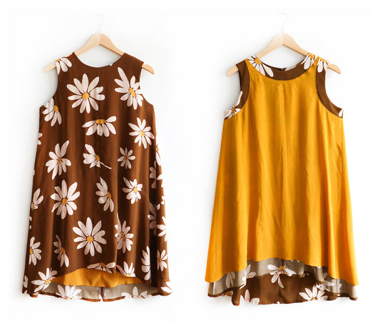 Lining the Sleeveless Farrow Dress Part 3: brown daisy print dress right side out and turned inside out showing gold lining