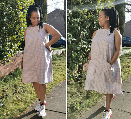 Pattern tester front and side views of Farrow Dress in tan windowpane check, sleeveless with pockets, worn with white sneakers