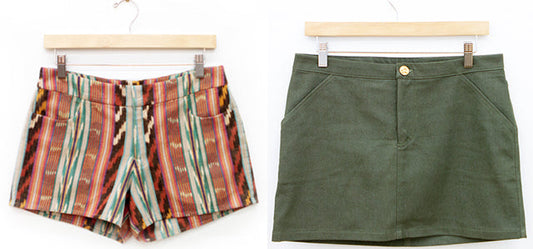 Maritime Shorts in red and teal ikat cotton and Moss Skirt in olive green denim on wooden hangers