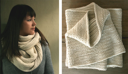 Cream herringbone cowl worn as an infinity scarf, shown folded flat to display the textured knit pattern