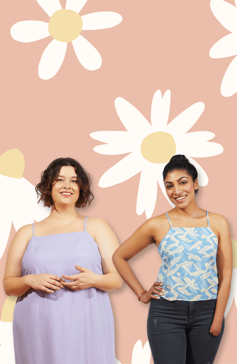 Two models wearing Myra on a pink daisy background. Lavender midi dress and blue leaf print top with dark jeans.