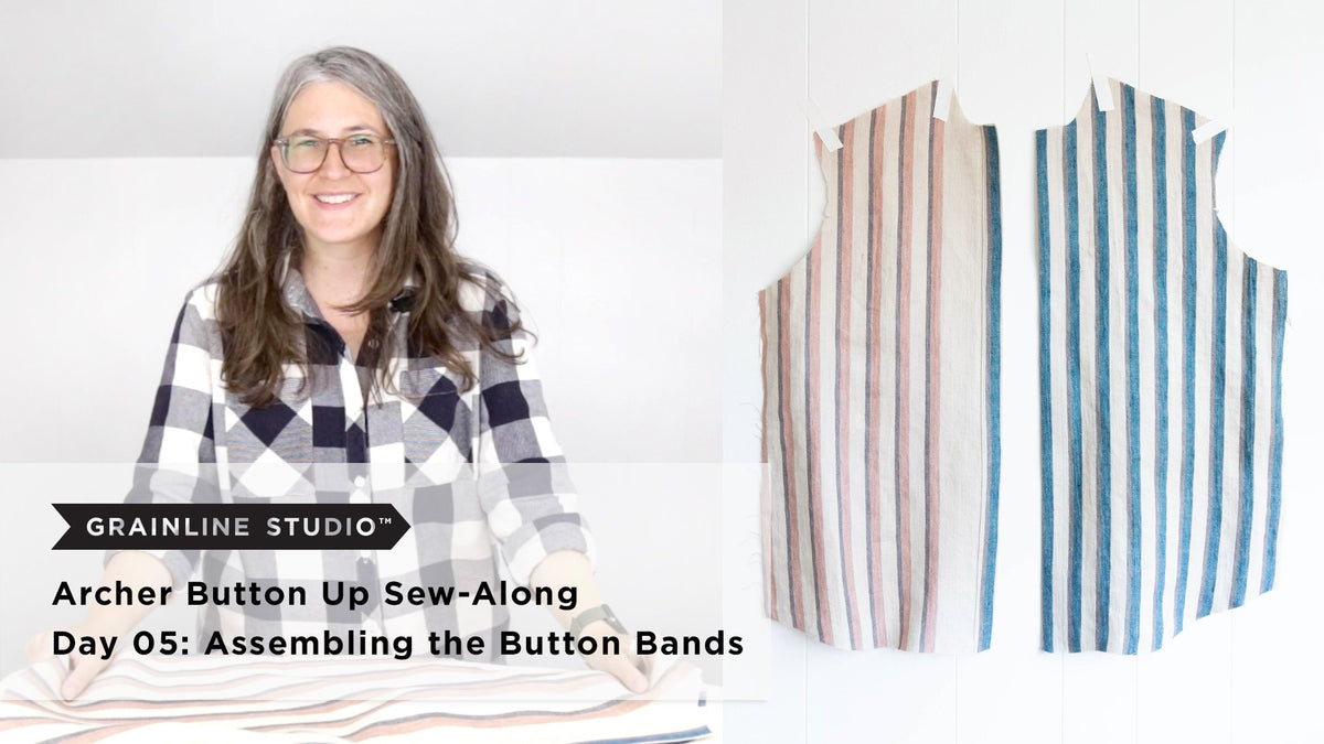 Woman smiling over striped fabric beside two striped linen shirt fronts with finished button bands hanging on a white wall