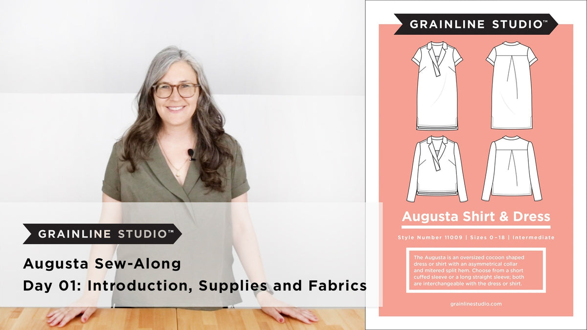 Woman in an olive linen Augusta with short cuffed sleeves beside the pattern envelope showing shirt and dress flats.