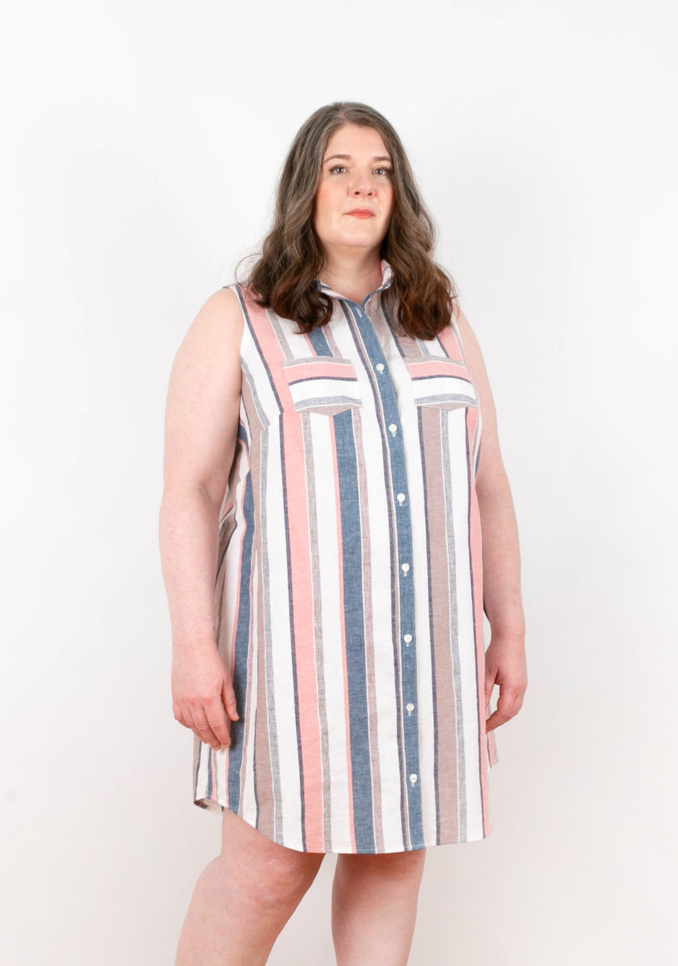 Angled front view of Alder Shirtdress View A in pastel stripes, showing chest pockets and collar details.